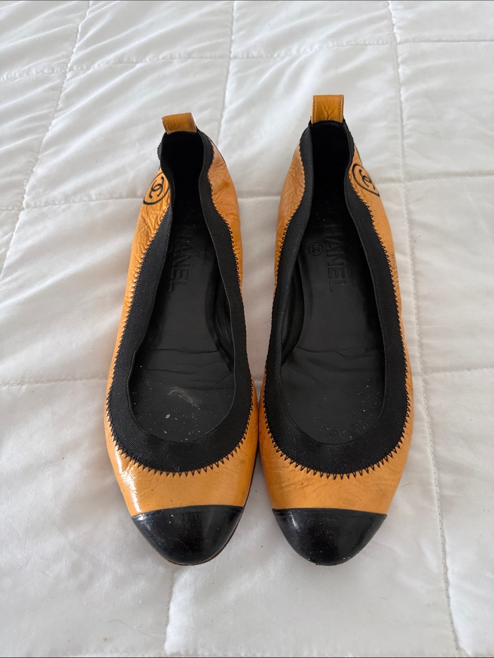 CHANEL Tan and Black Cap-Toe Ballet Flats
